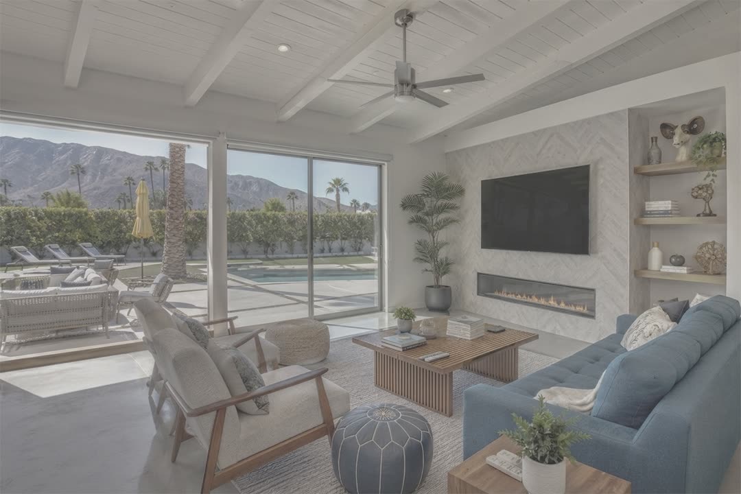 A Palm Springs living room straight out of camera: flat, hazy, and the window burned out to white.